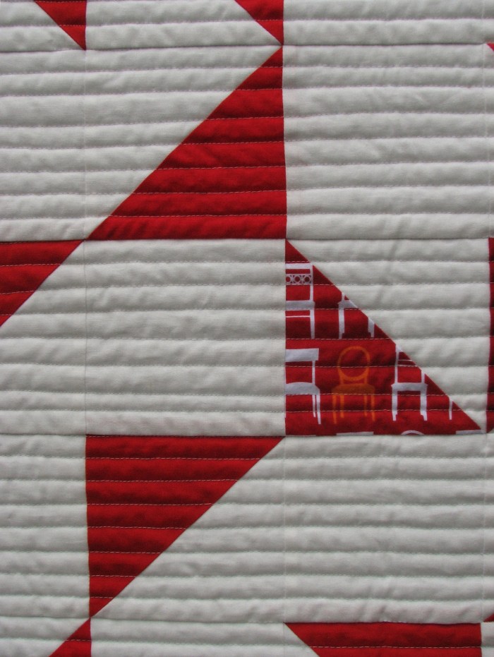 Detail - The maverick orange chair fabric which inspired the quilt name